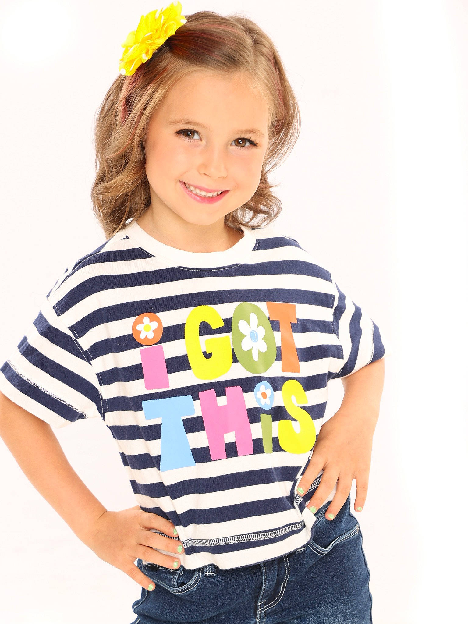 Patricia is registered to the contest to win money with this photo: arm, baby_toddler_clothing, child, electric_blue, fashion_accessory, fashion_design, gesture, hair, hairstyle, happy, head, joy, magenta, neck, pattern, person, sleeve, smile, t_shirt, toddler