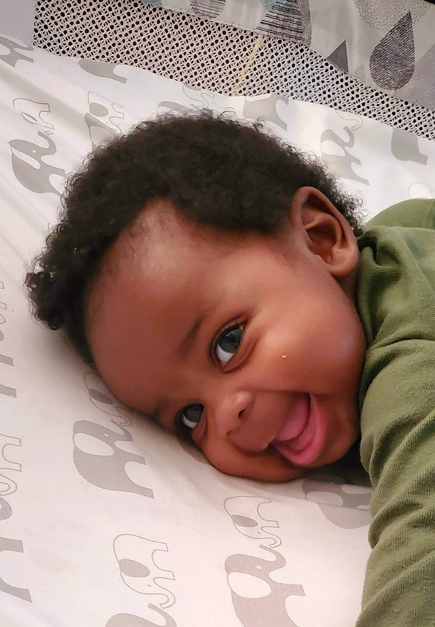 Jakari is registered to the contest to win money with this photo: baby, bedtime, black_hair, cheek, child, chin, ear, eye, face, forehead, happy, head, human, nose, person, skin, smile, toddler