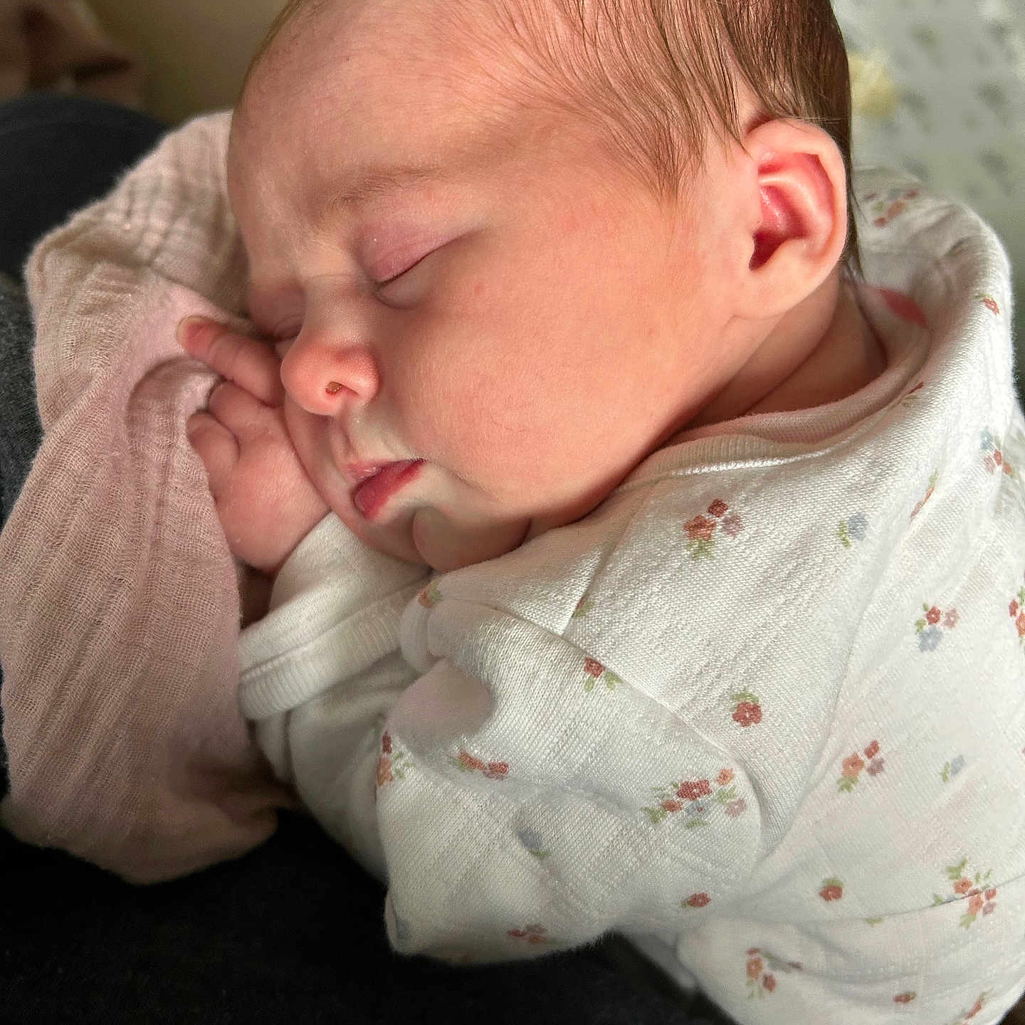 Ariella joined the competition — help win amazing prizes! baby, newborn, sleeping, infant, onesie, hand, face, head, skin, clothing, soft, peaceful, resting, closeup, pink, floral_pattern, cute, child, portrait, indoors