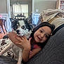 Sophie And Bandit joined the competition — help win amazing prizes! child, dog, couch, indoor, hugging, smiling, pet, home, furniture, blanket, girl, happy, living_room, black_and_white_dog, friendship, cute, domestic_animal, relaxing, portrait, casual