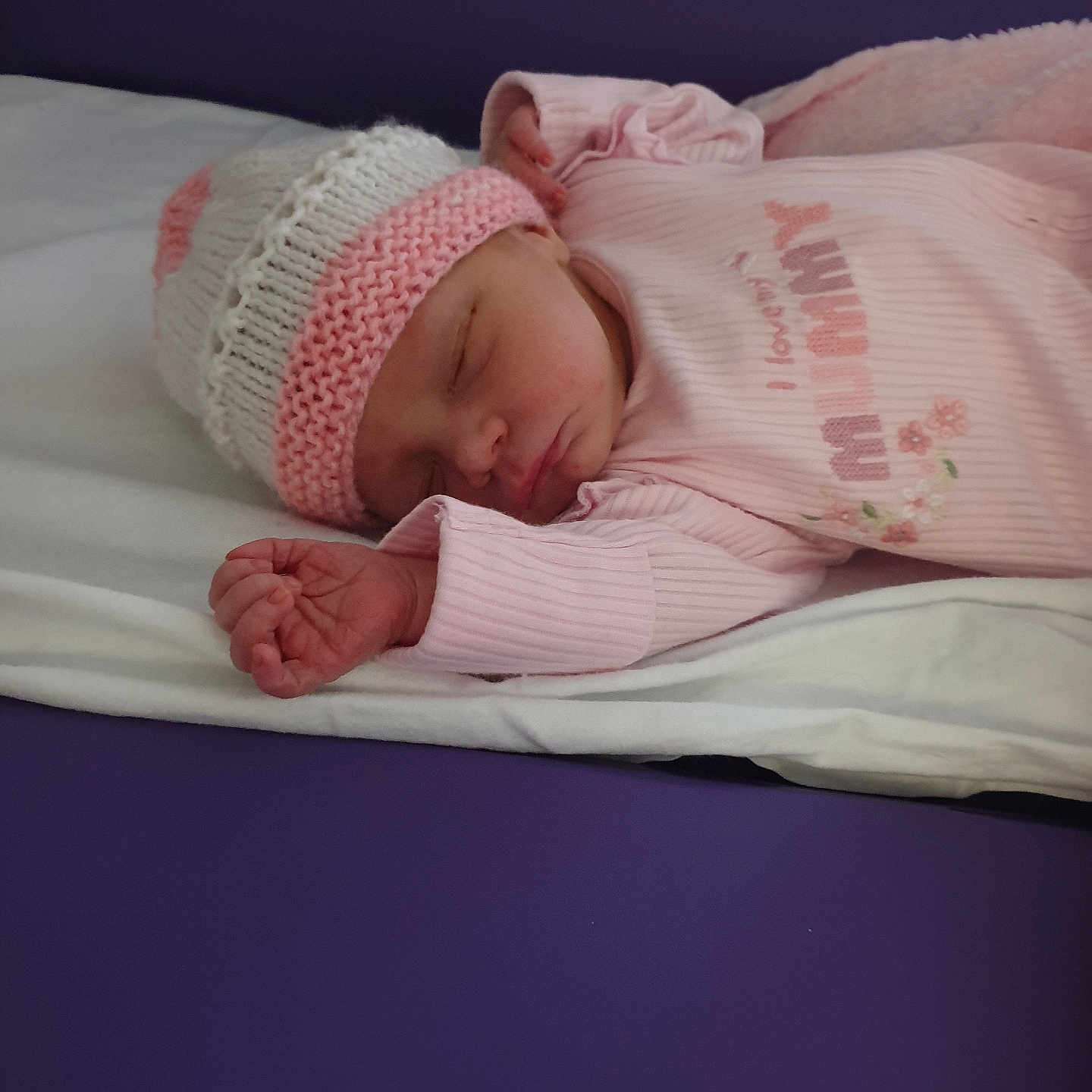 Erica joined the competition — help win amazing prizes! baby, blanket, child, cozy, cute, hat, human, indoors, infant, knitted_hat, lying_down, newborn, peaceful, pink_clothing, portrait, resting, sleeping, sleepwear, soft, toddler