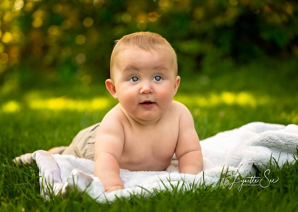 Jack is registered to the contest to win money with this photo: baby, baby_toddler_clothing, child, face, finger, flash_photography, fun, grass, grassland, hand, happy, lawn, leisure, meadow, people_in_nature, person, plant, skin, surprise, toddler