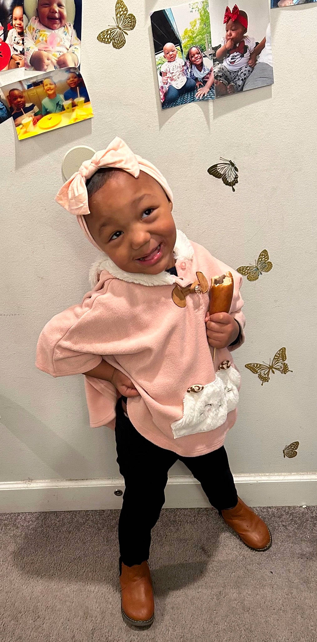 Amya is registered to the contest to win money with this photo: baseball_cap, boot, cap, child, costume, fashion_accessory, formal_wear, fun, fur, gesture, happy, hat, human_leg, joy, knee, person, skin, sleeve, smile, sock