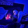 Apollo is registered to the contest to win money with this photo: bed, blanket, blue_light, cat, cozy, face, feline, indoor, night, person, pillow, resting, sleepy, soft_light, thoughtful, together, warm_glow, window_blinds, young_adult, quiet