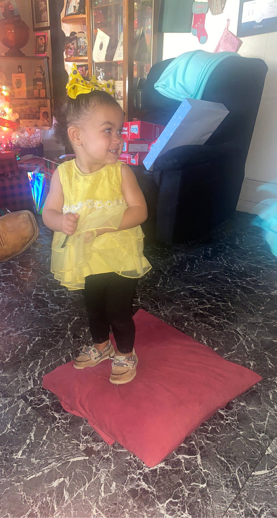 Kimber is registered to the contest to win money with this photo: baby, black, child, event, floor, flooring, fun, happy, joy, leisure, light, person, pink, recreation, shorts, sitting, smile, snapshot, sneakers, t_shirt