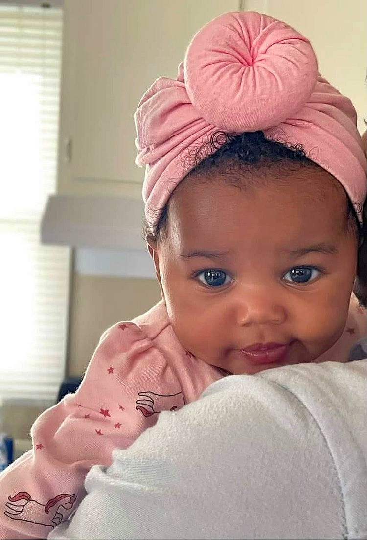 Imani joined the competition — help win amazing prizes! baby, baby_toddler_clothing, bridal_accessory, cap, cheek, comfort, ear, eyebrow, eyelash, hand, happy, headband, headpiece, lip, neck, nose, person, pink, skin, sleeve