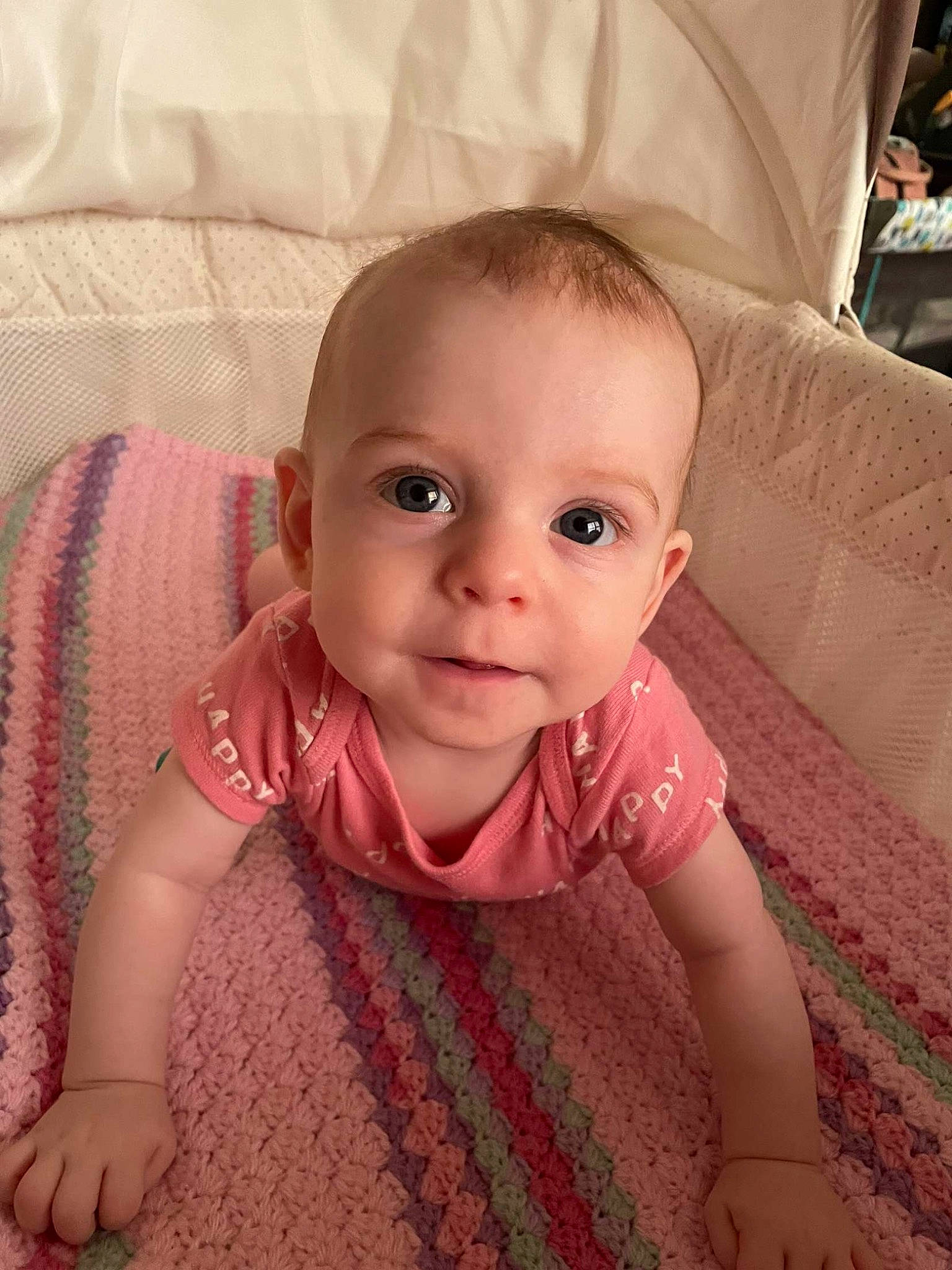 Sylvia is registered to the contest to win money with this photo: baby, baby_toddler_clothing, cheek, child, comfort, couch, eye, eyebrow, flooring, head, iris, linens, lip, nose, person, pink, skin, sleeve, textile, toddler