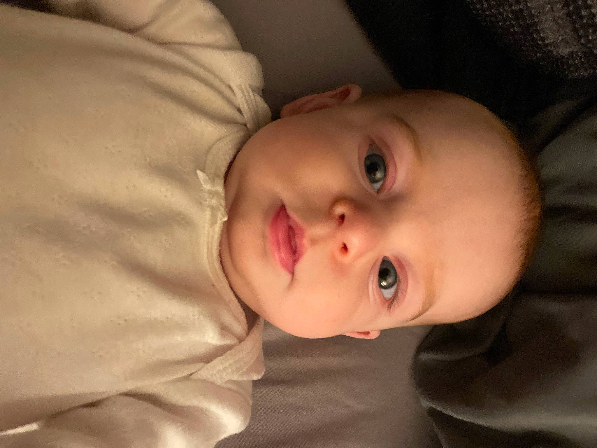 Sylvia is registered to the contest to win money with this photo: baby, baby_toddler_clothing, cheek, child, collar, comfort, eyebrow, eyelash, flash_photography, iris, lip, mouth, nose, person, plant, portrait_photography, skin, sleeve, smile, toddler