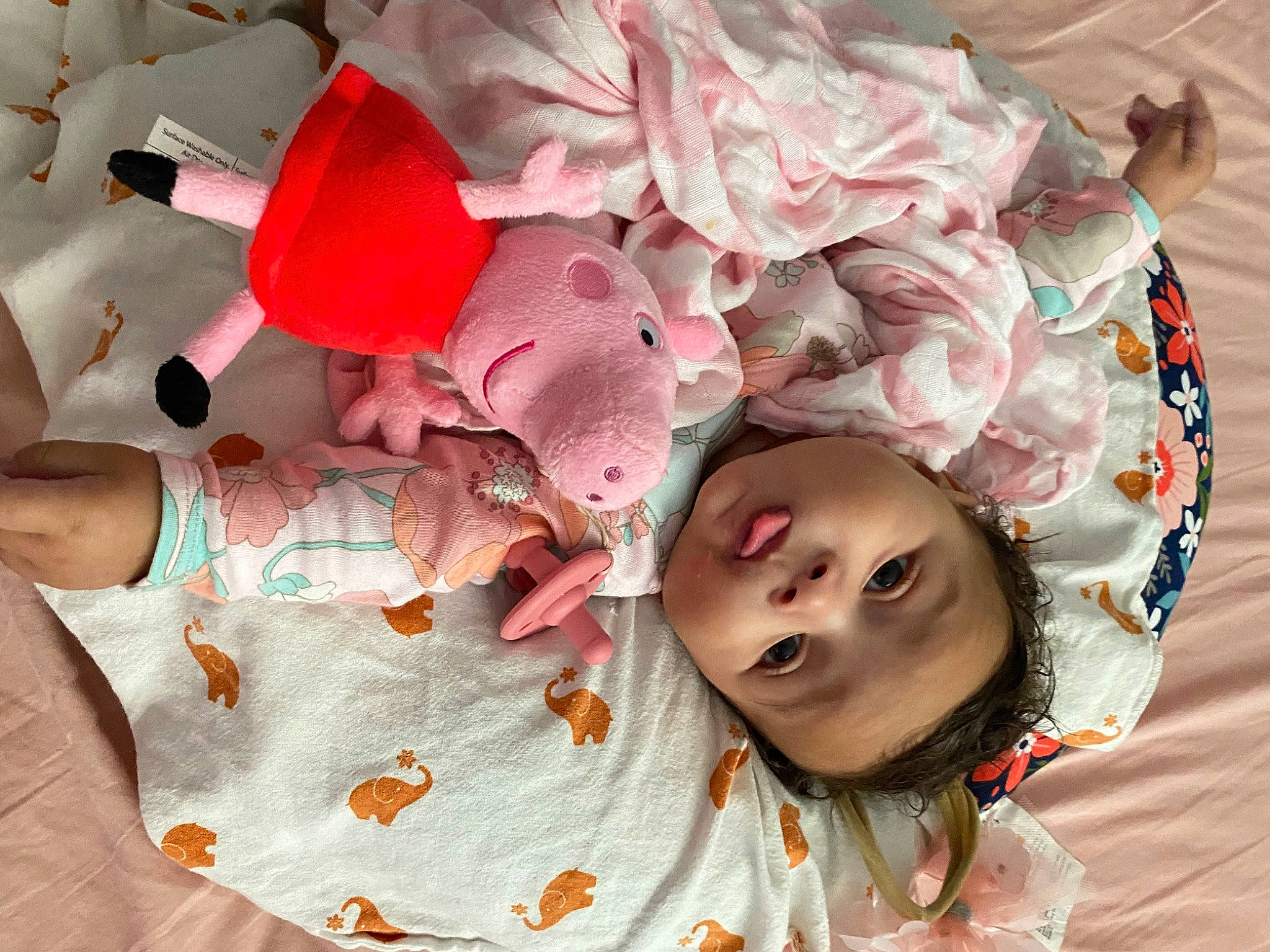 Dream is registered to the contest to win money with this photo: baby, baby_products, baby_toddler_clothing, carmine, cheek, child, fashion_accessory, fun, happy, headgear, linens, magenta, pattern, person, petal, pink, room, smile, textile, toddler
