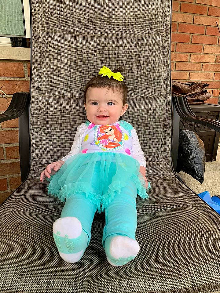 Keagan is registered to the contest to win money with this photo: baby, baby_toddler_clothing, child, costume, headgear, joy, pattern, person, pink, play, shoe, sitting, toddler, turquoise
