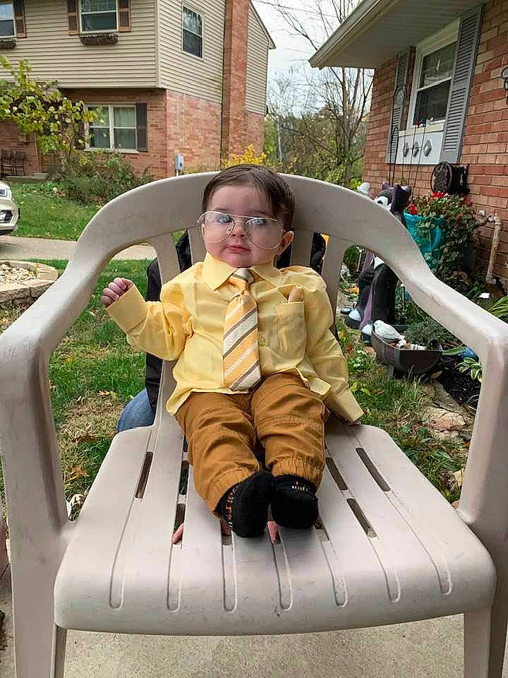 Keagan is registered to the contest to win money with this photo: chair, child, furniture, leisure, outdoor_furniture, person, plant, sitting