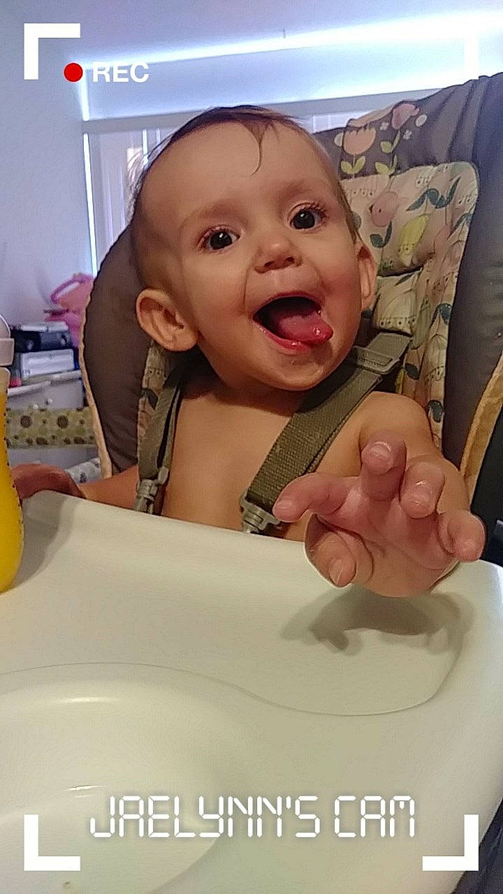 Eerika is registered to the contest to win money with this photo: baby, baby_food, cheek, child, comfort_food, eating, face, facial_expression, food, forehead, nose, person, photo_caption, skin, smile, toddler