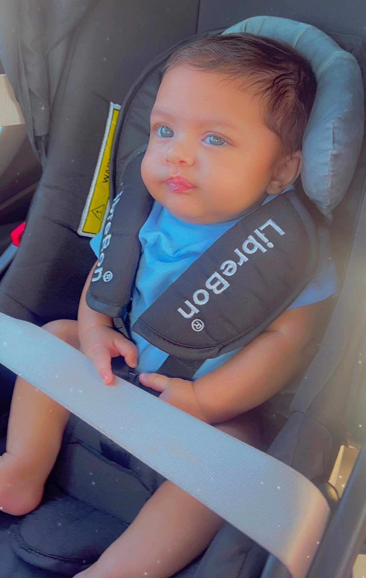 Arav joined the competition — help win amazing prizes! baby, baby_face, blue_shirt, car_interior, car_seat, child, child_safety, closeup, cute, hands, infant, infant_car_seat, legs, portrait, safety_harness, seat, seatbelt, soft_lighting, straps, travel