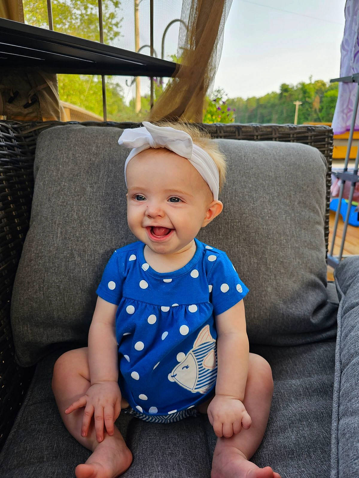 Bonnie is registered to the contest to win money with this photo: baby, baby_toddler_clothing, child, comfort, electric_blue, eye, finger, fun, happy, joy, leisure, pattern, person, product, sitting, skin, sky, sleeve, smile, toddler