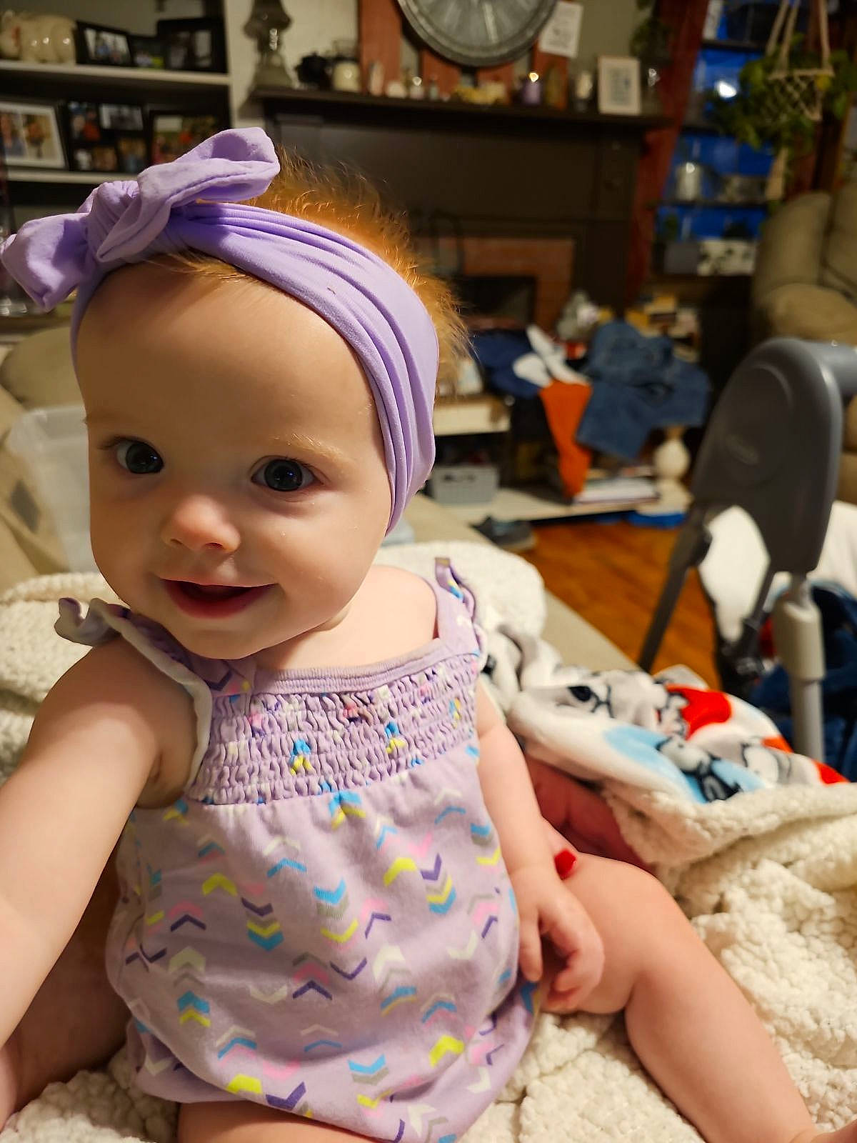 Bonnie is registered to the contest to win money with this photo: baby, baby_toddler_clothing, cap, cheek, child, costume_hat, fashion_accessory, fun, hair_accessory, happy, hat, headband, headpiece, person, pink, purple, room, skin, sleeve, smile