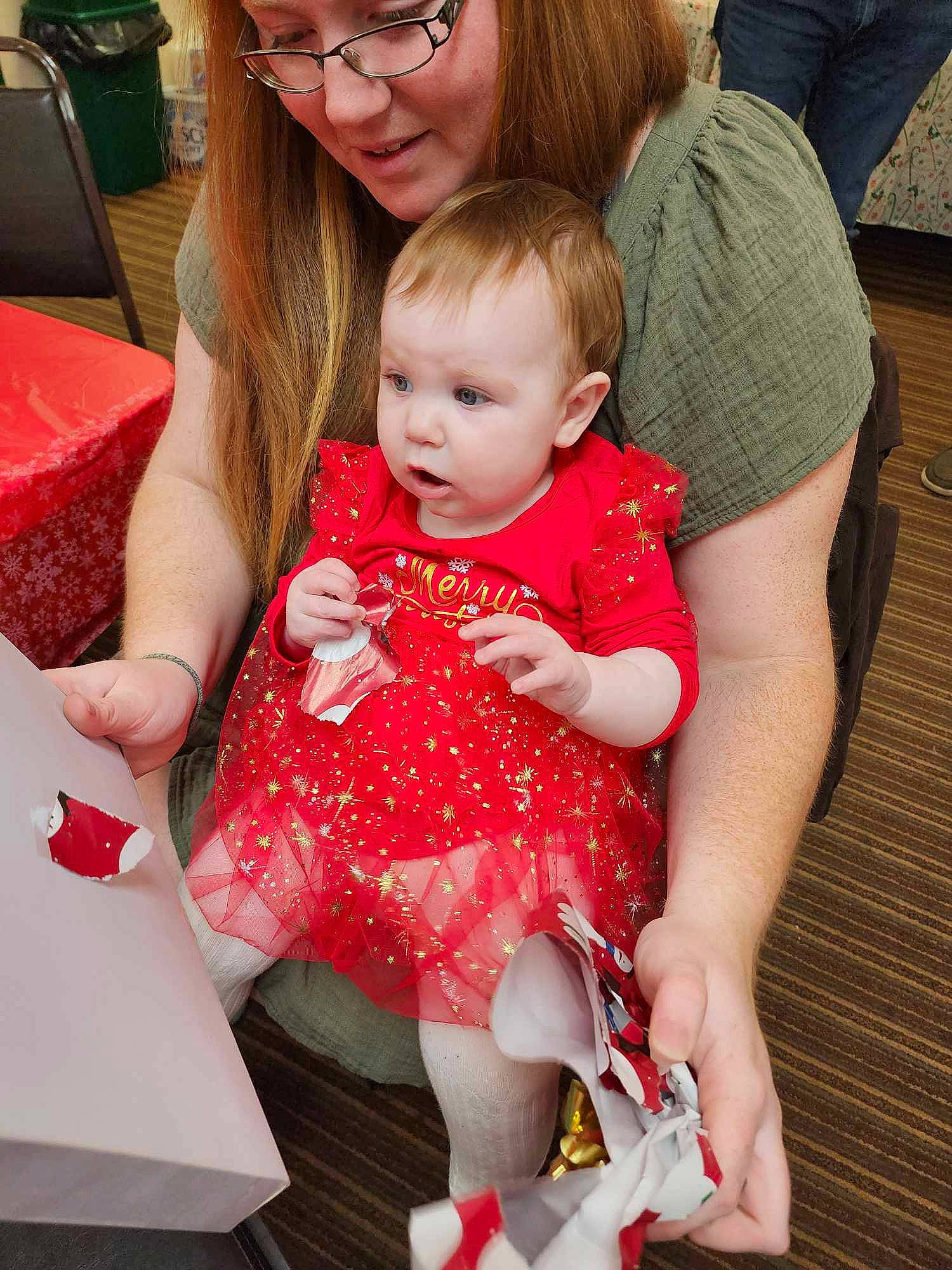 Cassidy joined the competition — help win amazing prizes! baby, baby_toddler_clothing, carmine, chair, cheek, child, dress, event, eyewear, fun, happy, head, joy, lap, pattern, person, pink, red, sitting, skin