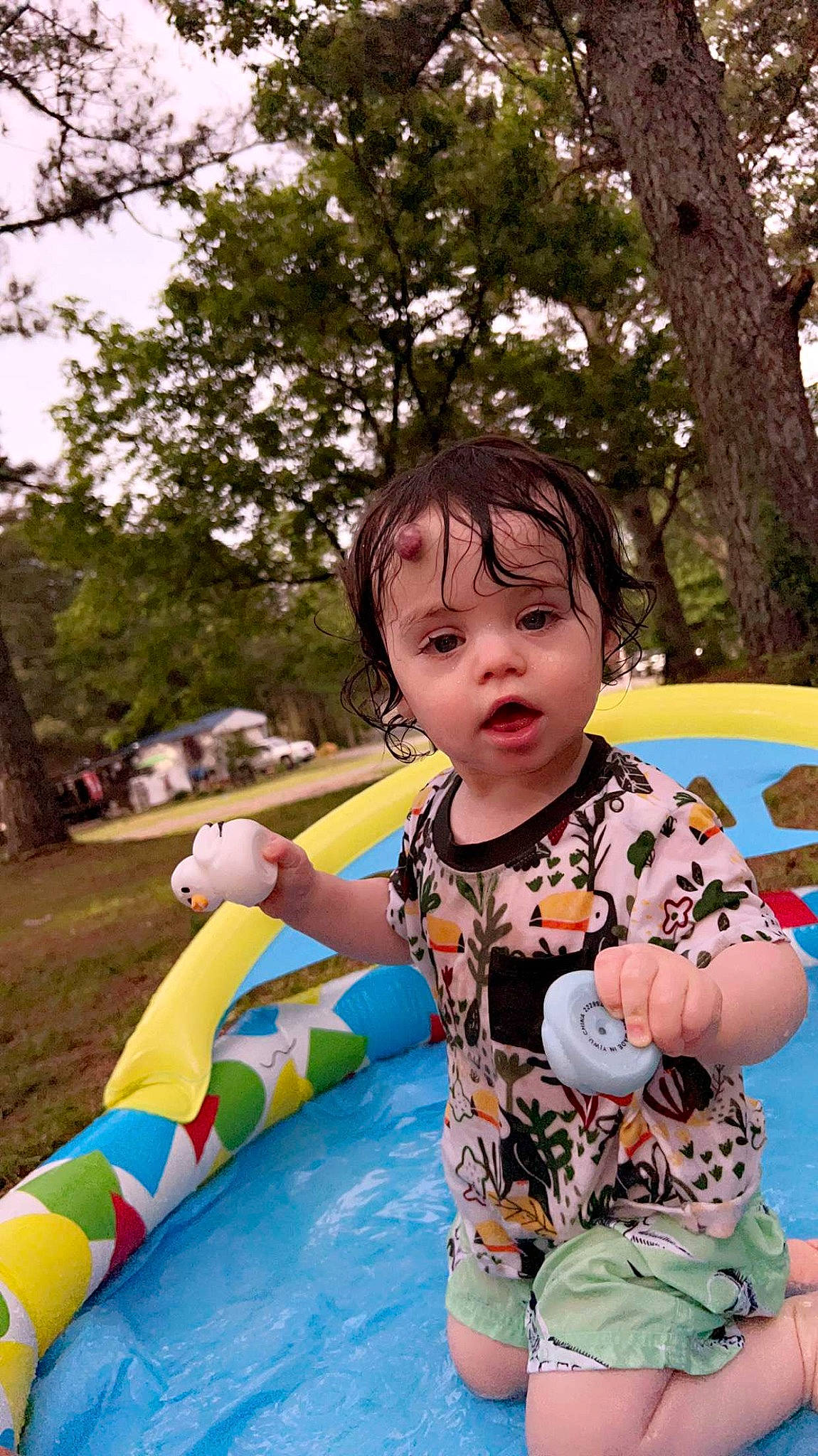 Cain is registered to the contest to win money with this photo: baby, baby_toddler_clothing, child, city, fun, grass, happy, inflatable, leisure, outdoor_play_equipment, people_in_nature, person, plant, play, playground, recreation, sitting, surprise, t_shirt, toddler