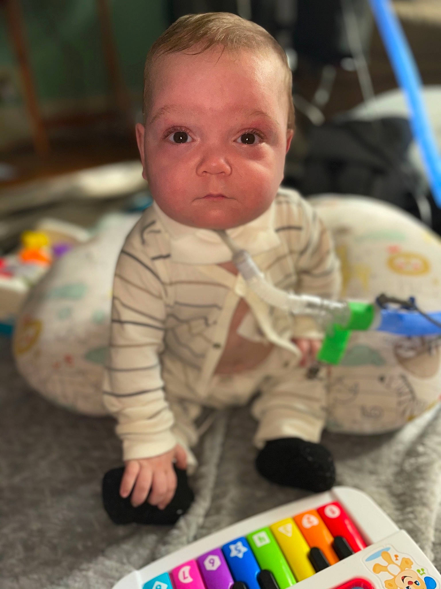 Christian is registered to the contest to win money with this photo: baby, baby_playing_with_toys, baby_products, baby_safety, baby_toddler_clothing, baby_toys, cheek, child, flooring, fun, nose, people, person, play, product, room, sitting, skin, toddler, toy