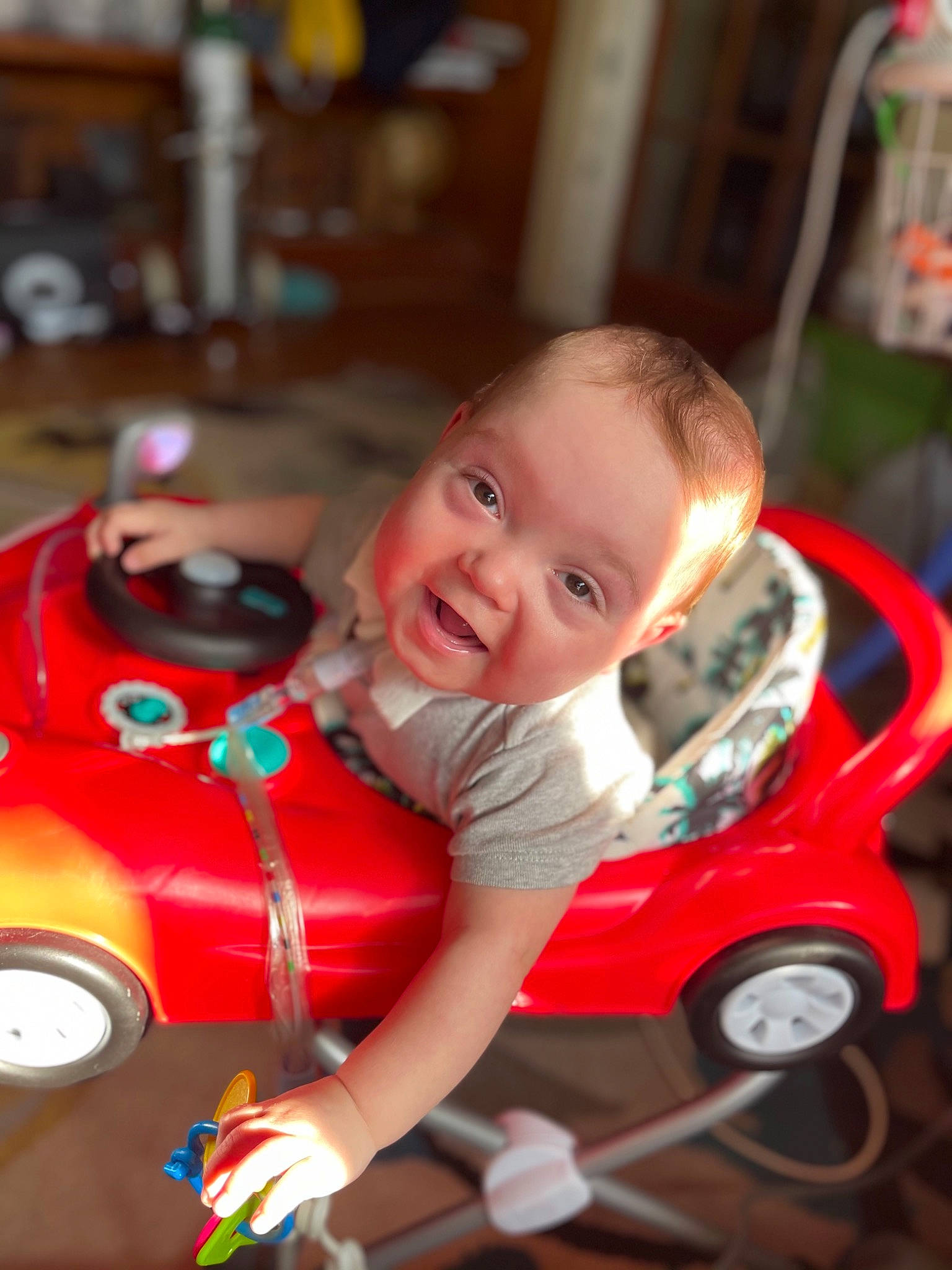 Christian joined the competition — help win amazing prizes! automotive_design, baby, baby_carriage, cheek, child, eye, fun, grass, happy, head, iris, motor_vehicle, person, riding_toy, skin, smile, tire, toddler, vehicle, wheel