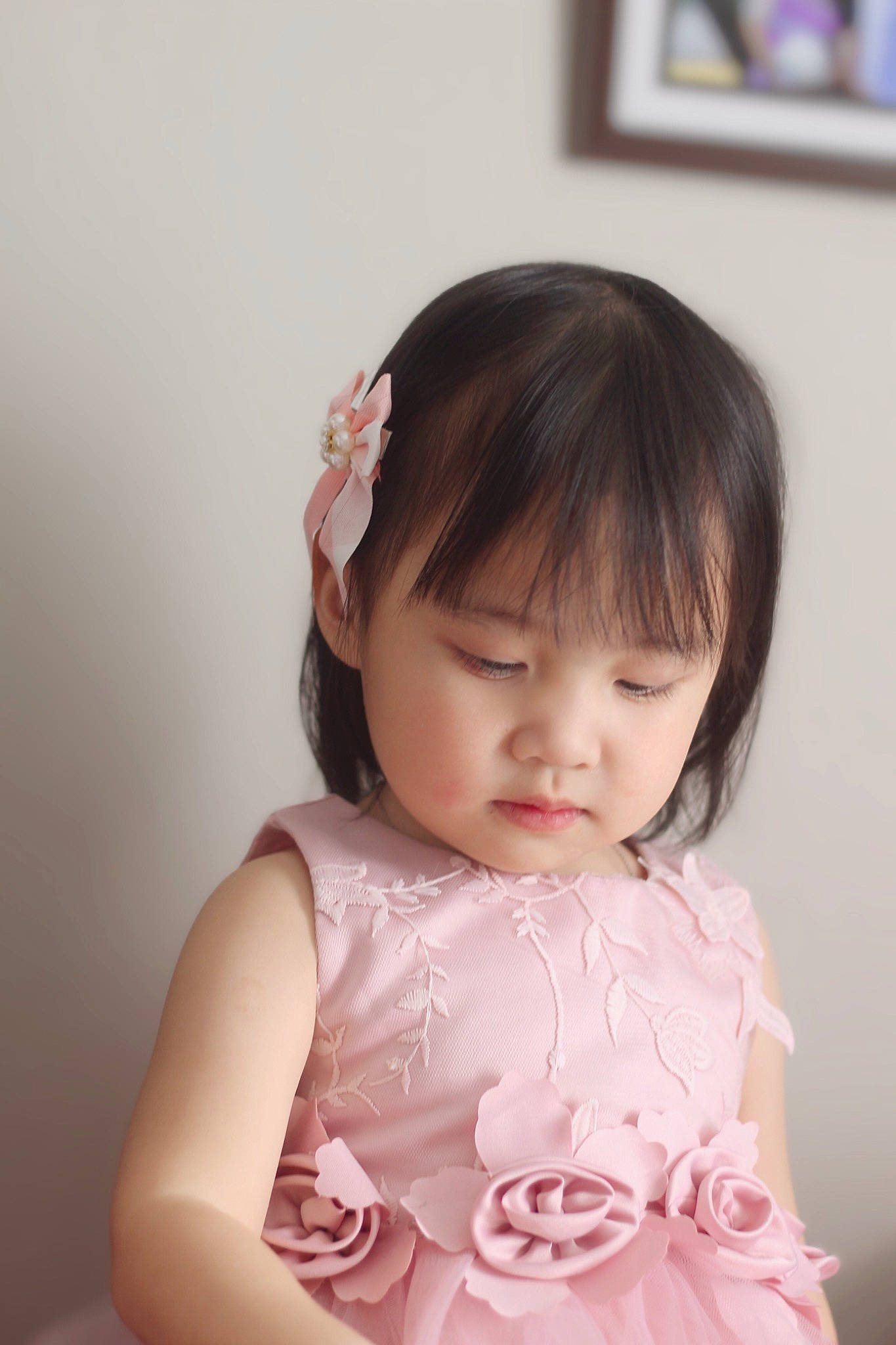 Miracle is registered to the contest to win money with this photo: arm, baby_toddler_clothing, cheek, chin, eyelash, facial_expression, finger, flash_photography, happy, iris, lip, neck, person, picture_frame, pink, shoulder, skin, sleeve, standing, textile