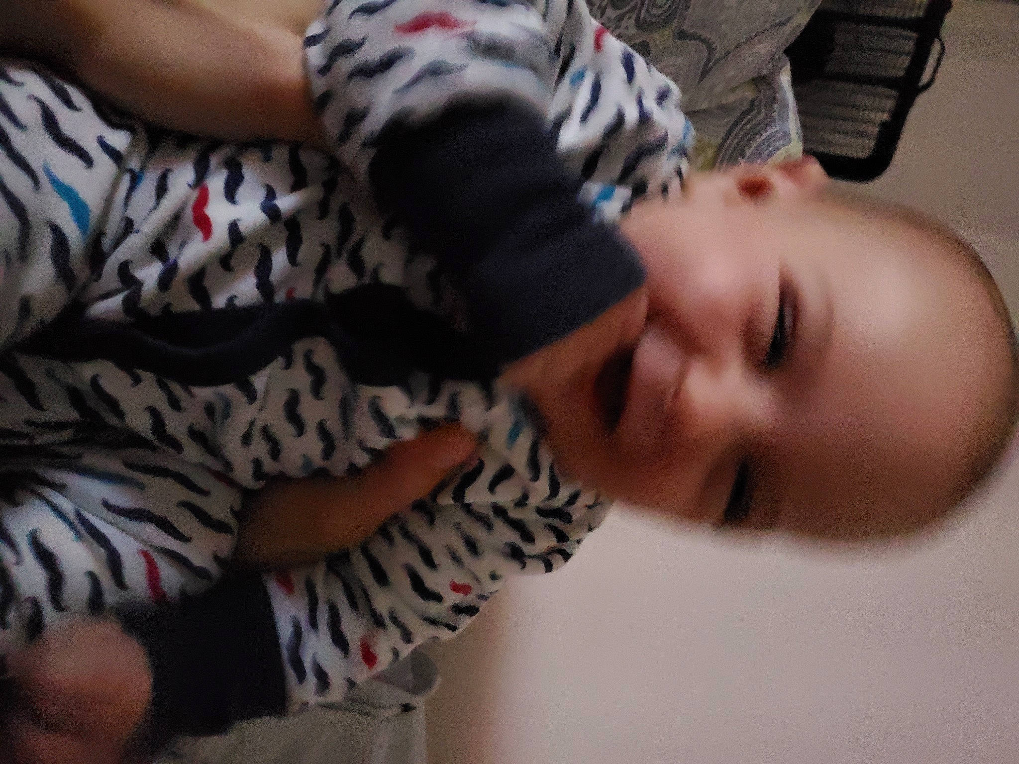 Callum is registered to the contest to win money with this photo: baby, baby_toddler_clothing, cheek, child, comfort, elbow, eyelash, finger, fun, gesture, happy, joy, mouth, nose, pattern, person, skin, sleeve, smile, toddler