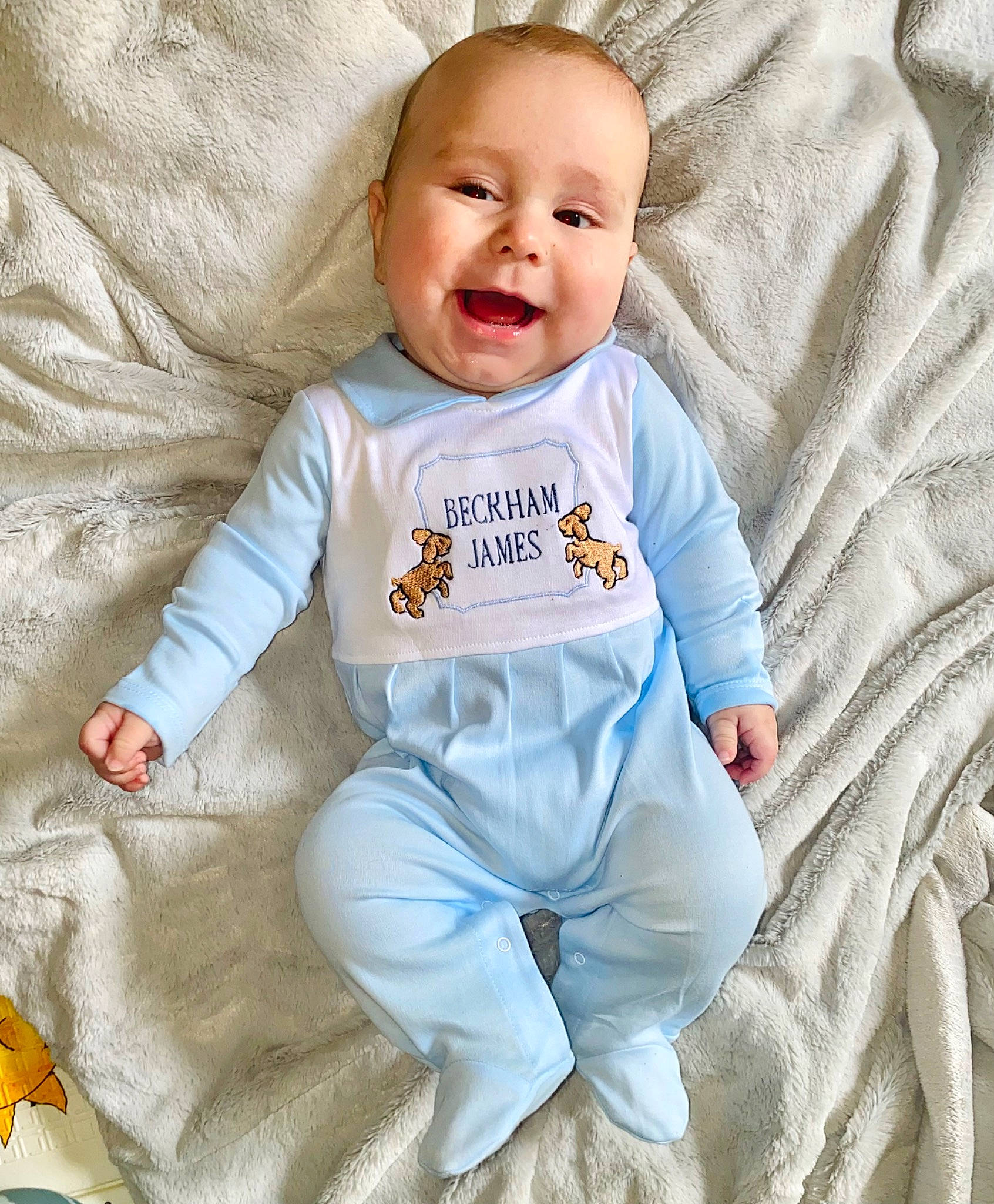 Beckham joined the competition — help win amazing prizes! baby, baby_products, baby_toddler_clothing, child, comfort, electric_blue, facial_expression, happy, joy, linens, outerwear, pattern, person, portrait_photography, sitting, skin, sleeve, smile, sportswear, t_shirt