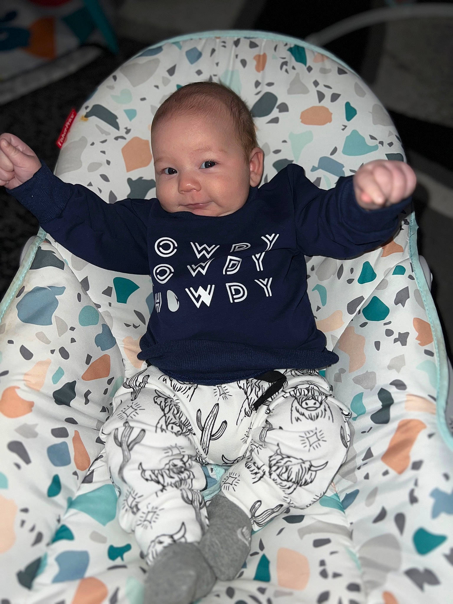 Colter is registered to the contest to win money with this photo: baby, baby_products, baby_toddler_clothing, beauty, child, comfort, fun, happy, head, linens, mammal, pattern, person, product, sitting, sleeve, smile, t_shirt, textile, toddler