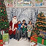 Ayaru is registered to the contest to win money with this photo: santa_claus, child, children, christmas_tree, presents, holiday, festive, winter_backdrop, smiling, indoor, celebration, decorations, gifts, seasonal, happy, family, group, together, joy, portrait