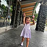 Savannah joined the competition — help win amazing prizes! child, toddler, dress, shoes, smiling, walking, outdoor, sidewalk, stone_pillars, glass_doors, reflection, trees, daylight, happy, person, architecture, concrete_floor, building, light, joy