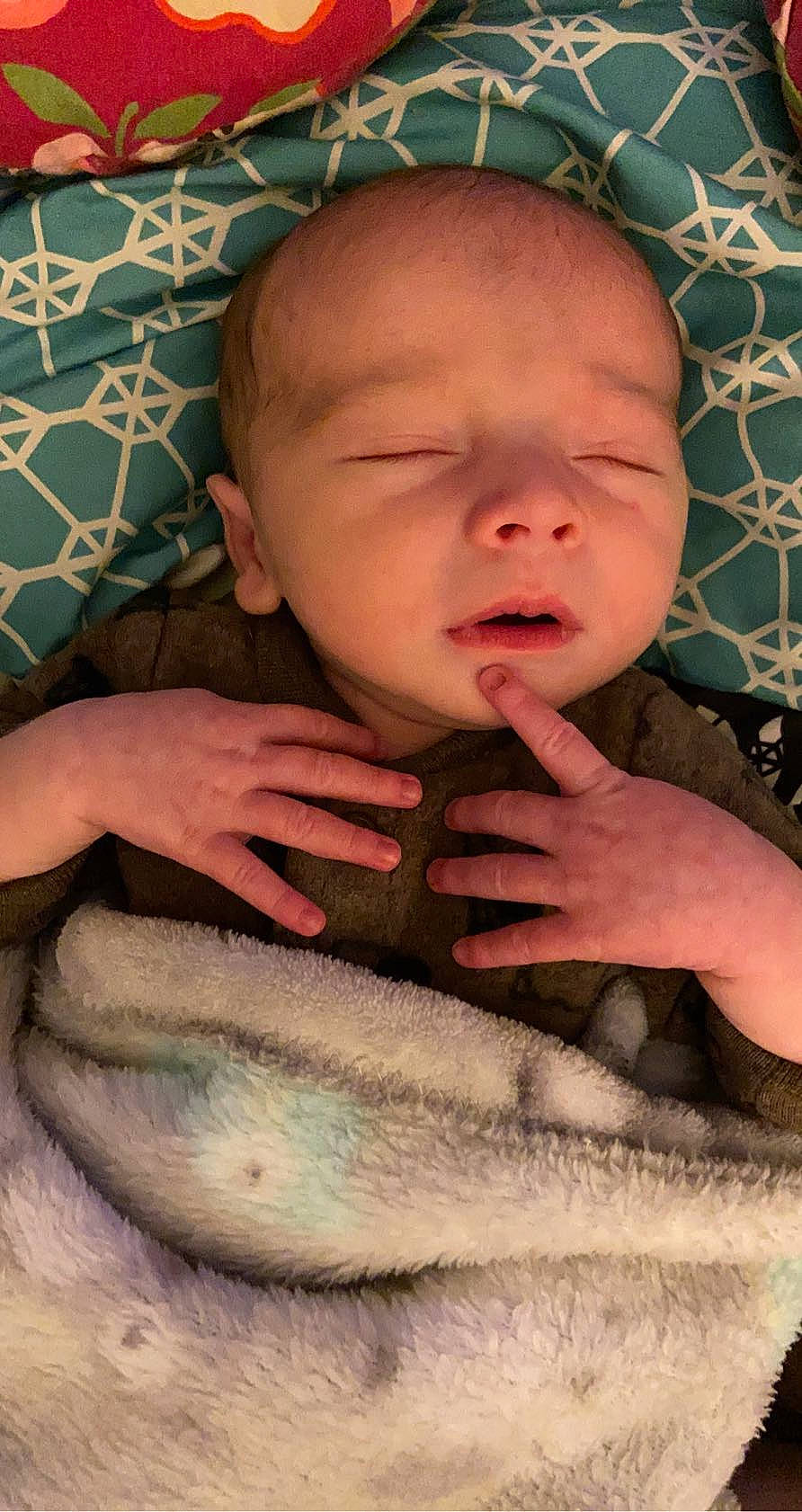 Hutson Kendrick is registered to the contest to win money with this photo: arm, baby, baby_toddler_clothing, cheek, child, chin, comfort, eye, eyebrow, finger, gesture, hand, human_body, lip, mouth, neck, nose, person, skin, thumb
