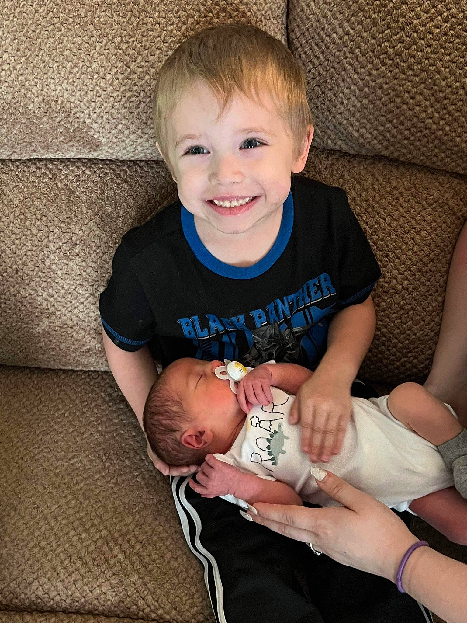 Tristen Kendrick is registered to the contest to win money with this photo: arm, baby, baby_toddler_clothing, cheek, comfort, couch, eye, face, finger, gesture, hair, hairstyle, hand, happy, head, human_body, iris, joy, leg, person