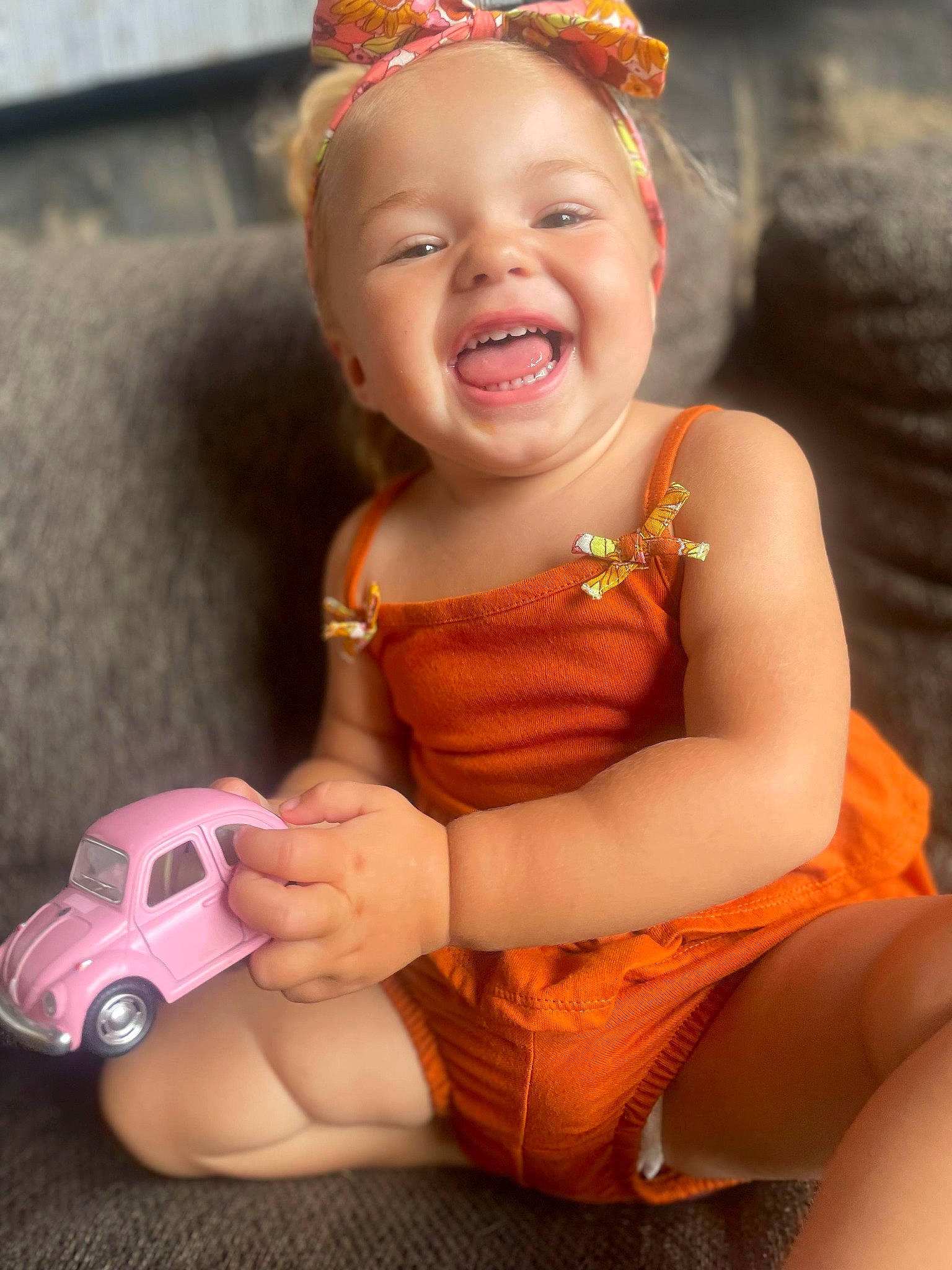 Ma'Leah joined the competition — help win amazing prizes! baby_toddler_clothing, blond, child, event, facial_expression, flash_photography, fun, happy, head, human_leg, jewellery, necklace, orange, organ, person, pink, riding_toy, skin, smile, toddler