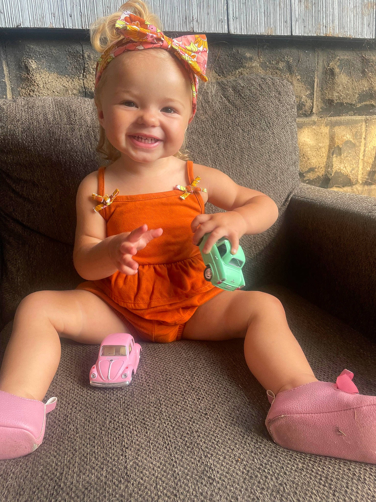 Ma'Leah is registered to the contest to win money with this photo: baby_toddler_clothing, beauty, child, finger, foot, fun, hairstyle, happy, human_leg, joy, lap, leg, magenta, person, pink, skin, smile, snapshot, sock, thigh