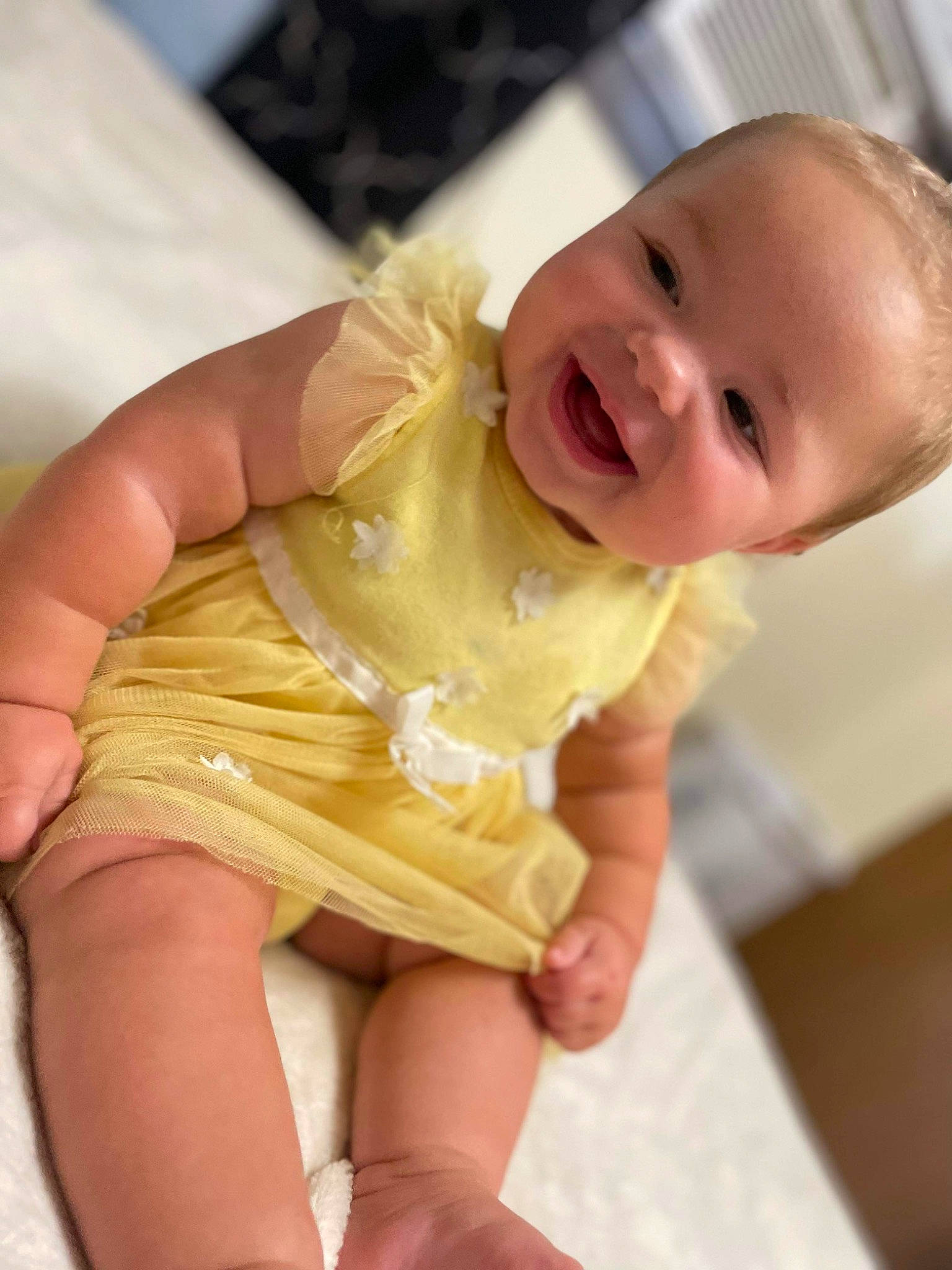 Maleah is registered to the contest to win money with this photo: baby, baby_laughing, baby_toddler_clothing, blond, cheek, dress, finger, gesture, hand, happy, iris, joy, mouth, neck, nose, person, pink, skin, smile, thigh