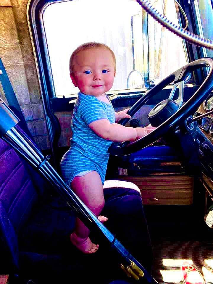 Terrell Jr is registered to the contest to win money with this photo: arm, automotive_design, automotive_exterior, automotive_tire, blue, cool, electric_blue, flash_photography, fun, human_body, leisure, mode_of_transport, motor_vehicle, person, recreation, rim, sitting, steering_wheel, toddler, vehicle_door