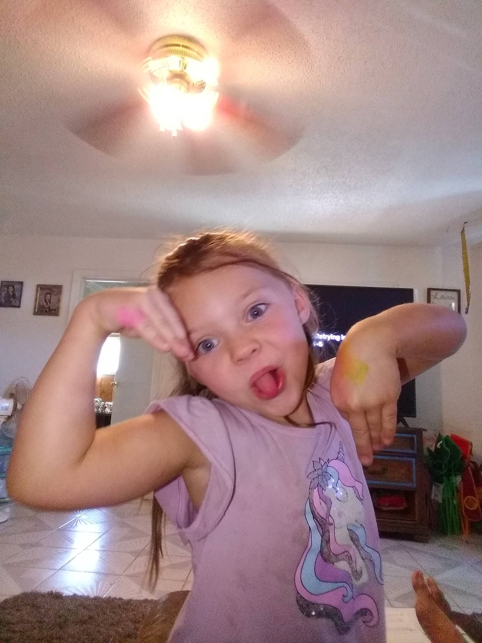 Allison is registered to the contest to win money with this photo: baby, ceiling, child, cooking, finger, flash_photography, flooring, fun, gesture, hairstyle, happy, muscle, person, room, shoulder, sitting, skin, t_shirt, thumb, toddler