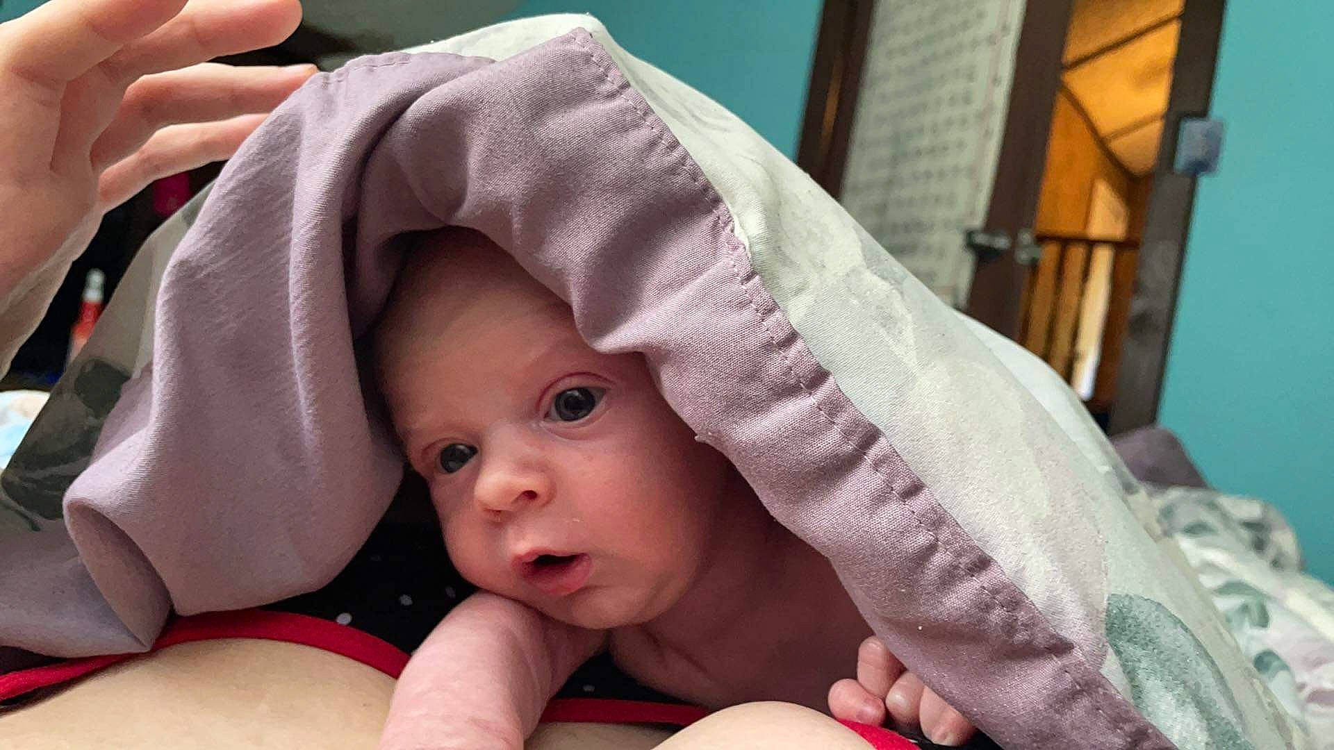 Stephan is registered to the contest to win money with this photo: baby, baby_products, baby_safety, baby_toddler_clothing, cheek, child, comfort, finger, foot, gesture, hand, happy, headwear, linens, mouth, nail, person, pink, sitting, skin