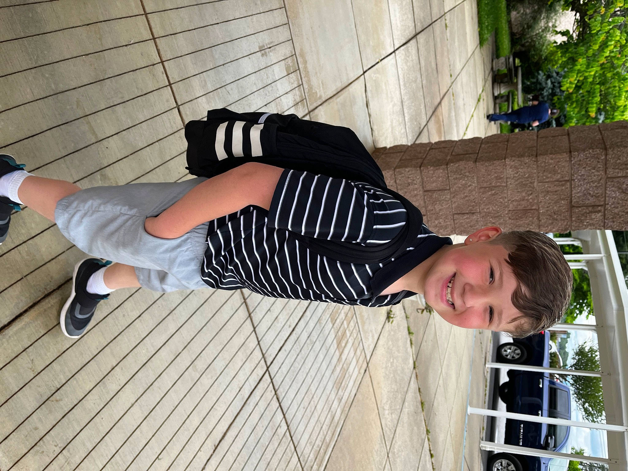 Cadence is registered to the contest to win money with this photo: composite_material, elbow, eyewear, flooring, fun, human_leg, joy, knee, leisure, pattern, person, plant, sleeve, smile, sportswear, street_fashion, t_shirt, thigh, tree, waist