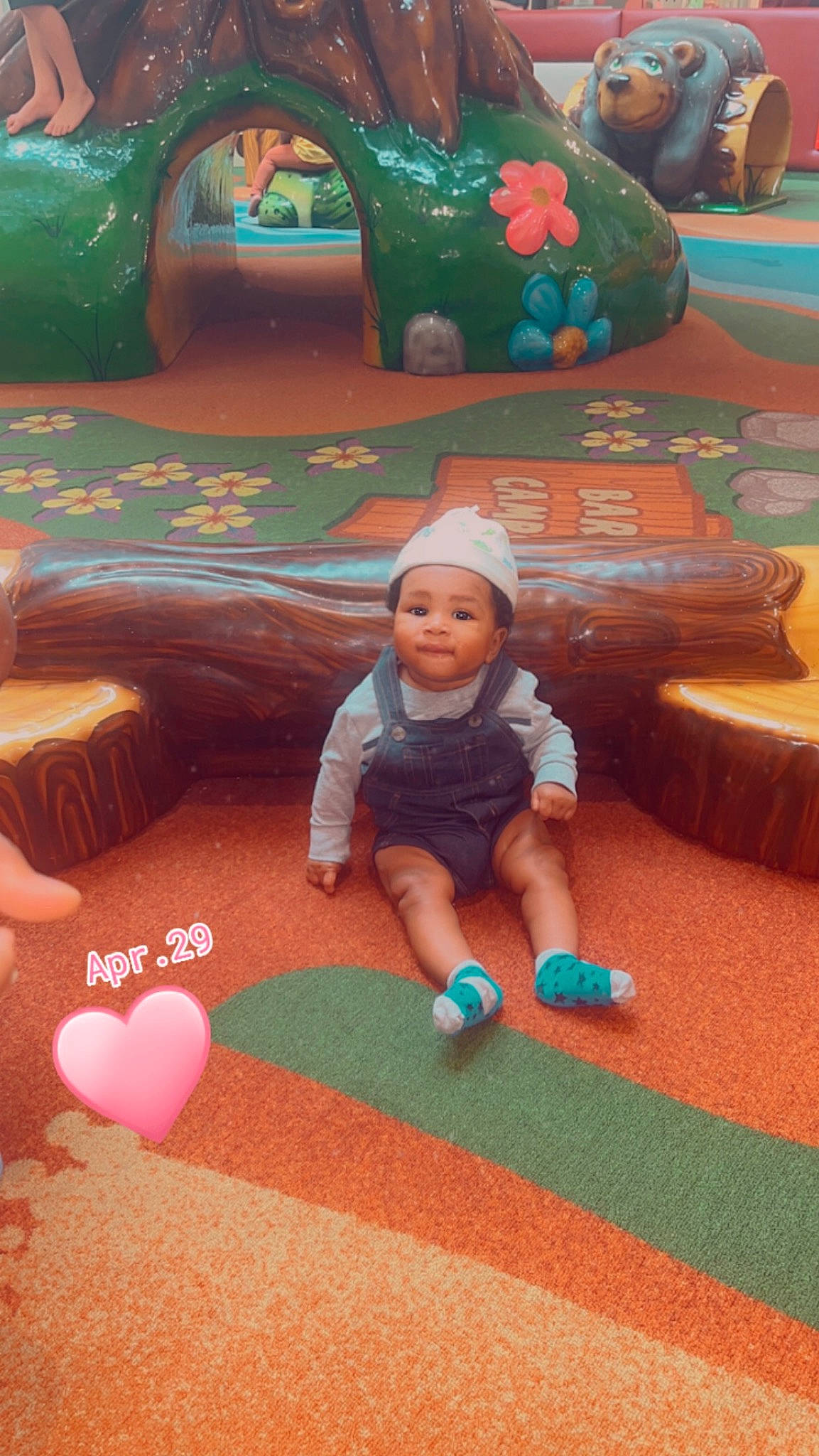 Josiah is registered to the contest to win money with this photo: baby, baby_toddler_clothing, child, comfort, floor, flooring, fun, grass, green, headwear, leisure, people, person, playground, product, recreation, sitting, skin, snapshot, toddler