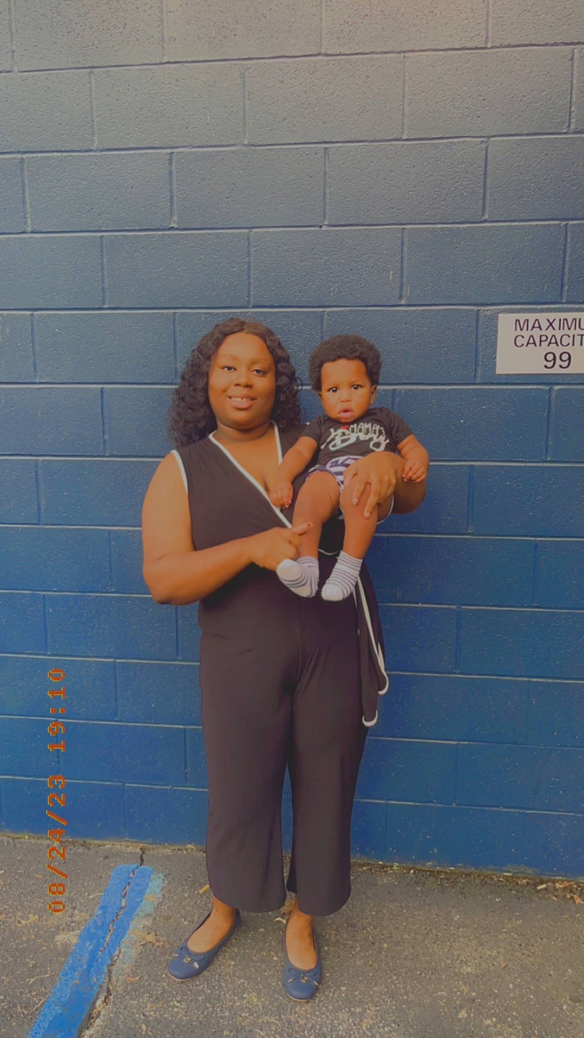 Josiah is registered to the contest to win money with this photo: abdomen, arm, art, baby, brick, brickwork, child, electric_blue, eyewear, gesture, happy, human_leg, joint, joy, person, shoulder, sitting, standing, t_shirt, toddler