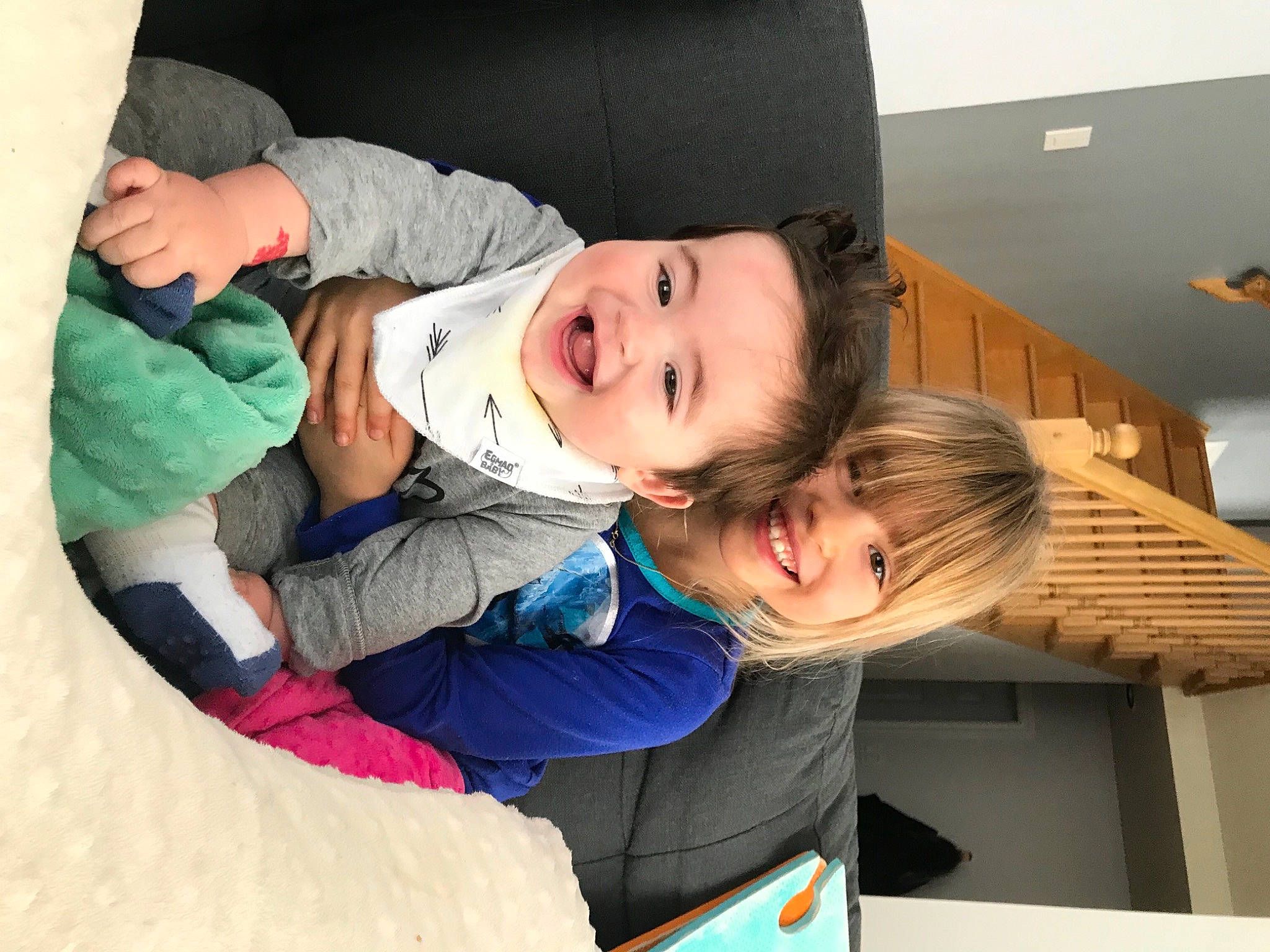 Jackson participe au concours pour gagner de l'argent avec cette photo : baby, baby_toddler_clothing, cheek, child, comfort, couch, event, eye, fun, happy, joy, lap, mouth, people, person, room, sitting, skin, smile, toddler