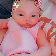 Lillian joined the competition — help win amazing prizes! baby, child, pink_dress, butterfly_filter, face, hand, person, infant, cute, closeup, portrait, soft_lighting, indoor, cuddling, apparel, skin, young_child, holding, filter, expressionless