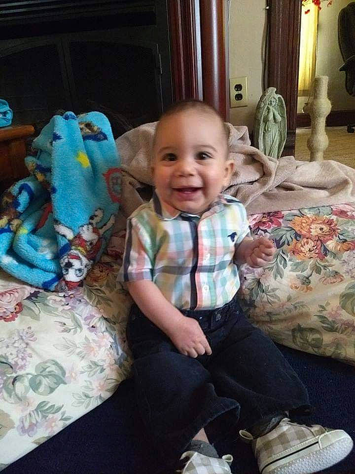 Christian is registered to the contest to win money with this photo: baby, cheek, child, face, family, head, joy, people, person, play, room, shoe, sitting, skin, smile, toddler, vacation