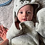 George joined the competition — help win amazing prizes! baby, child, towel, hooded_towel, face, blue_eyes, hand, soft_texture, blanket, cute, infant, wrapped, curious, skin, portrait, indoors, closeup, person, fabric, cozy
