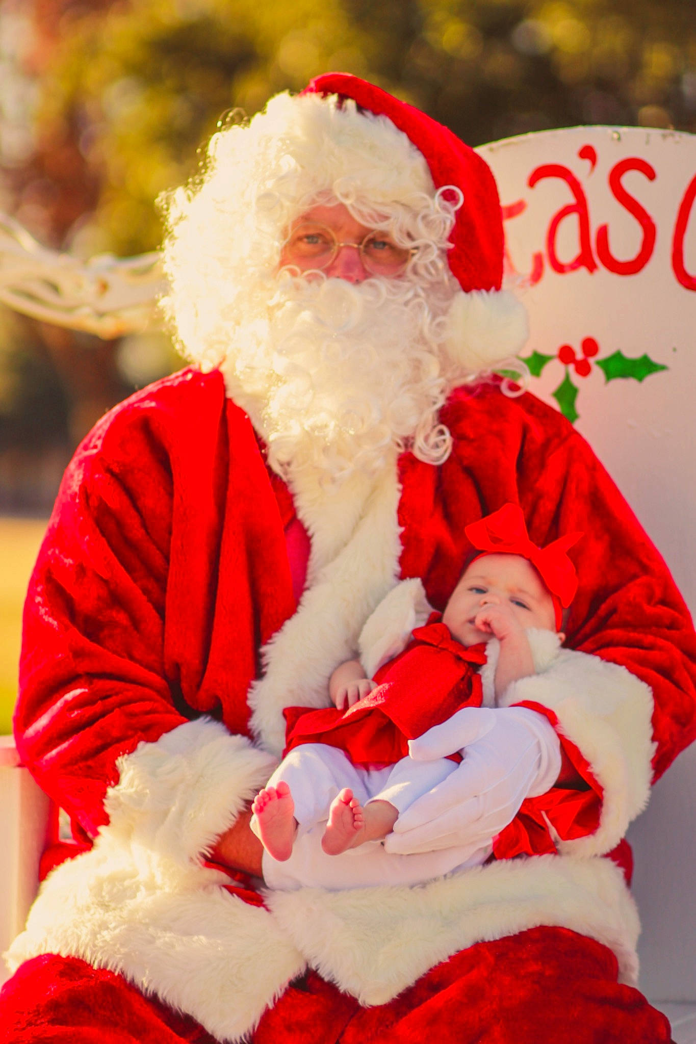 Bexley joined the competition — help win amazing prizes! beard, christmas, christmas_eve, costume, costume_accessory, costume_hat, event, facial_hair, fictional_character, fur, fur_clothing, happy, headwear, holiday, human_body, lap, moustache, person, red, santa_claus