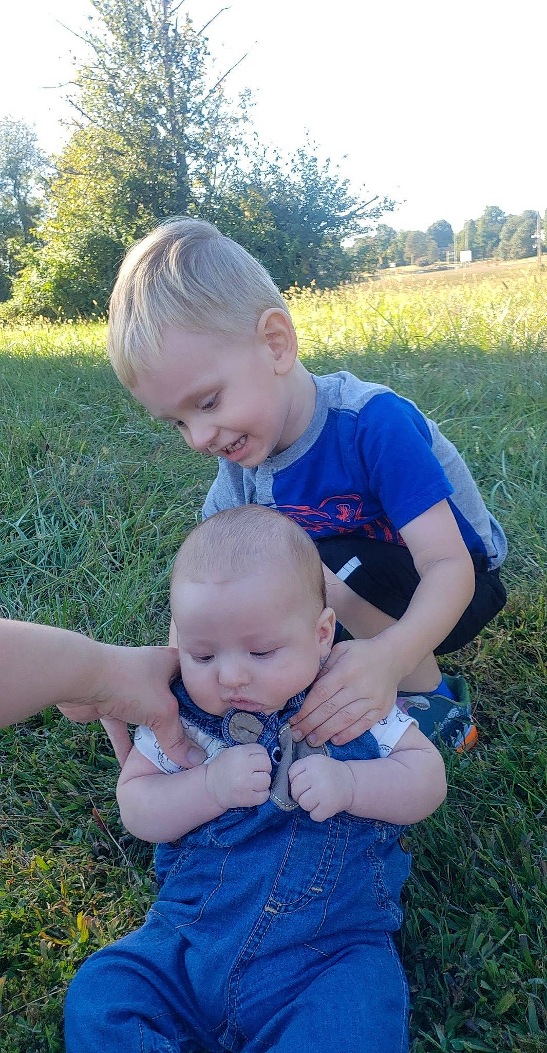 Theodore joined the competition — help win amazing prizes! baby, baby_toddler_clothing, child, electric_blue, fun, garden, grass, grass_family, grassland, happy, lawn, leaf, people_in_nature, person, plant, sitting, skin, summer, toddler, tree