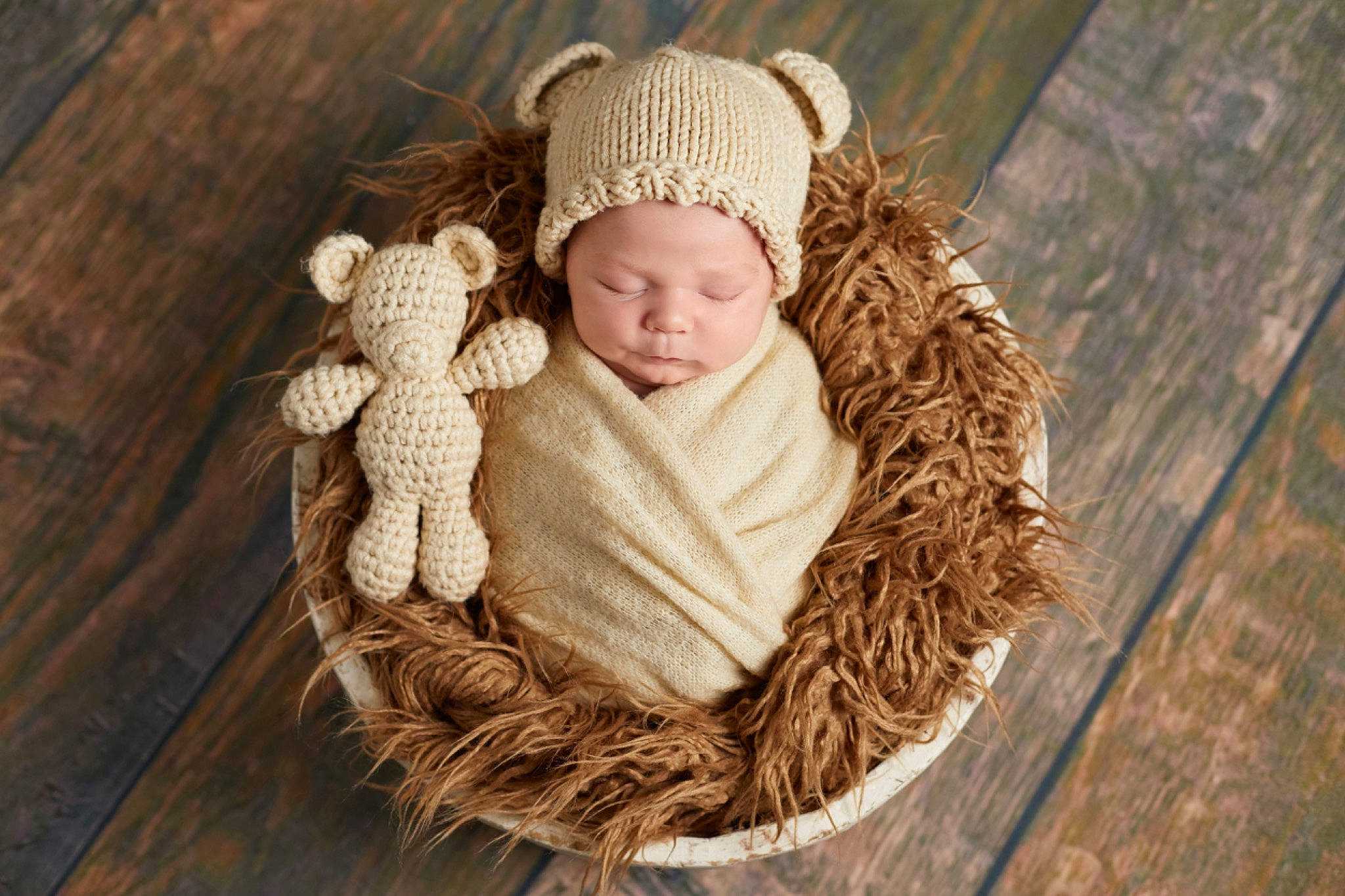 Austin is registered to the contest to win money with this photo: baby, baby_toddler_clothing, basket, cap, costume_hat, crochet, fashion_accessory, fur, grass, headgear, headwear, knit_cap, outerwear, people_in_nature, person, thread, toddler, twig, wicker, wood