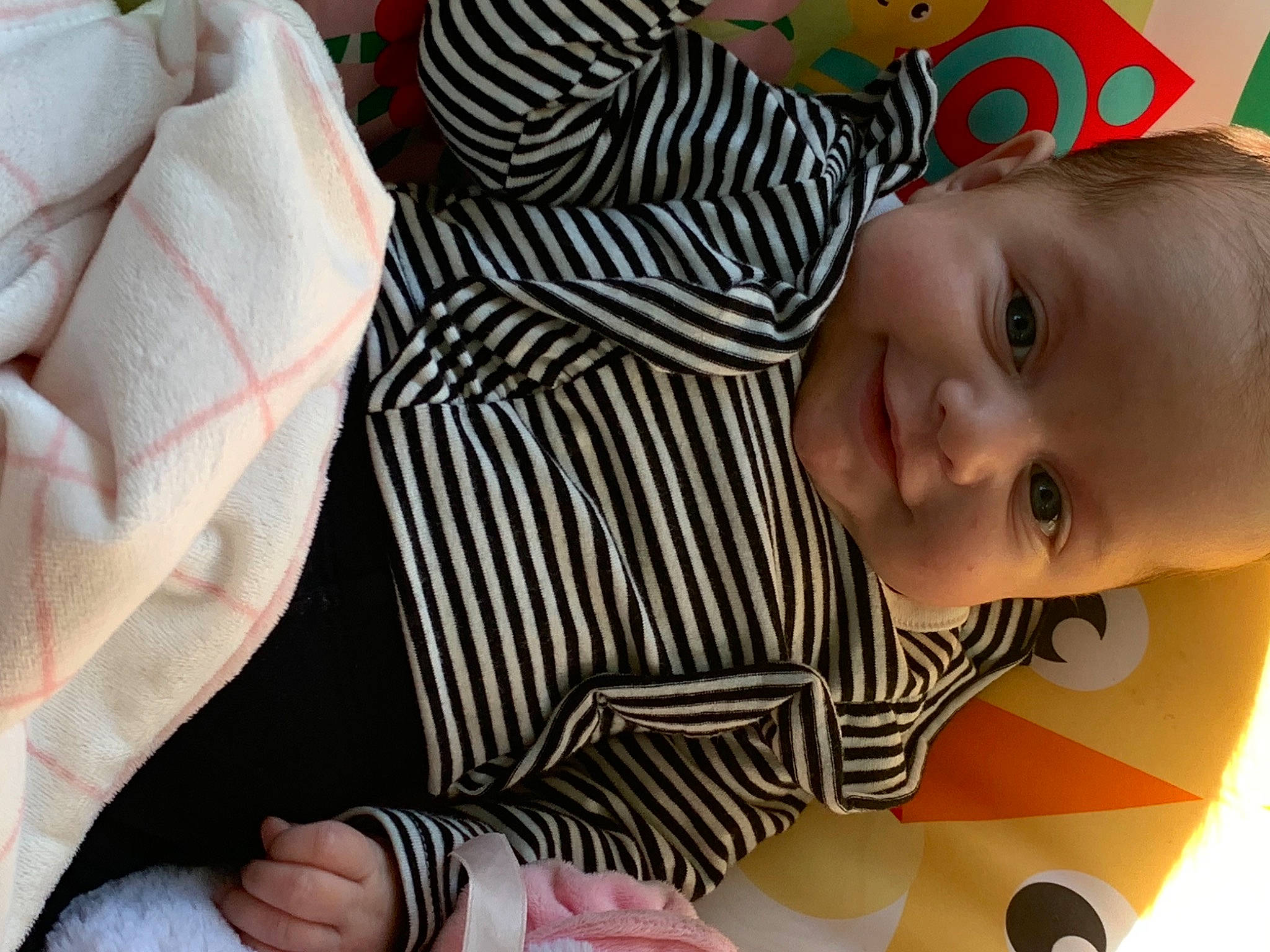 Finley joined the competition — help win amazing prizes! baby, baby_toddler_clothing, cheek, child, comfort, finger, flooring, happy, iris, joy, lip, mouth, nose, pattern, person, pink, skin, sleeve, smile, toddler