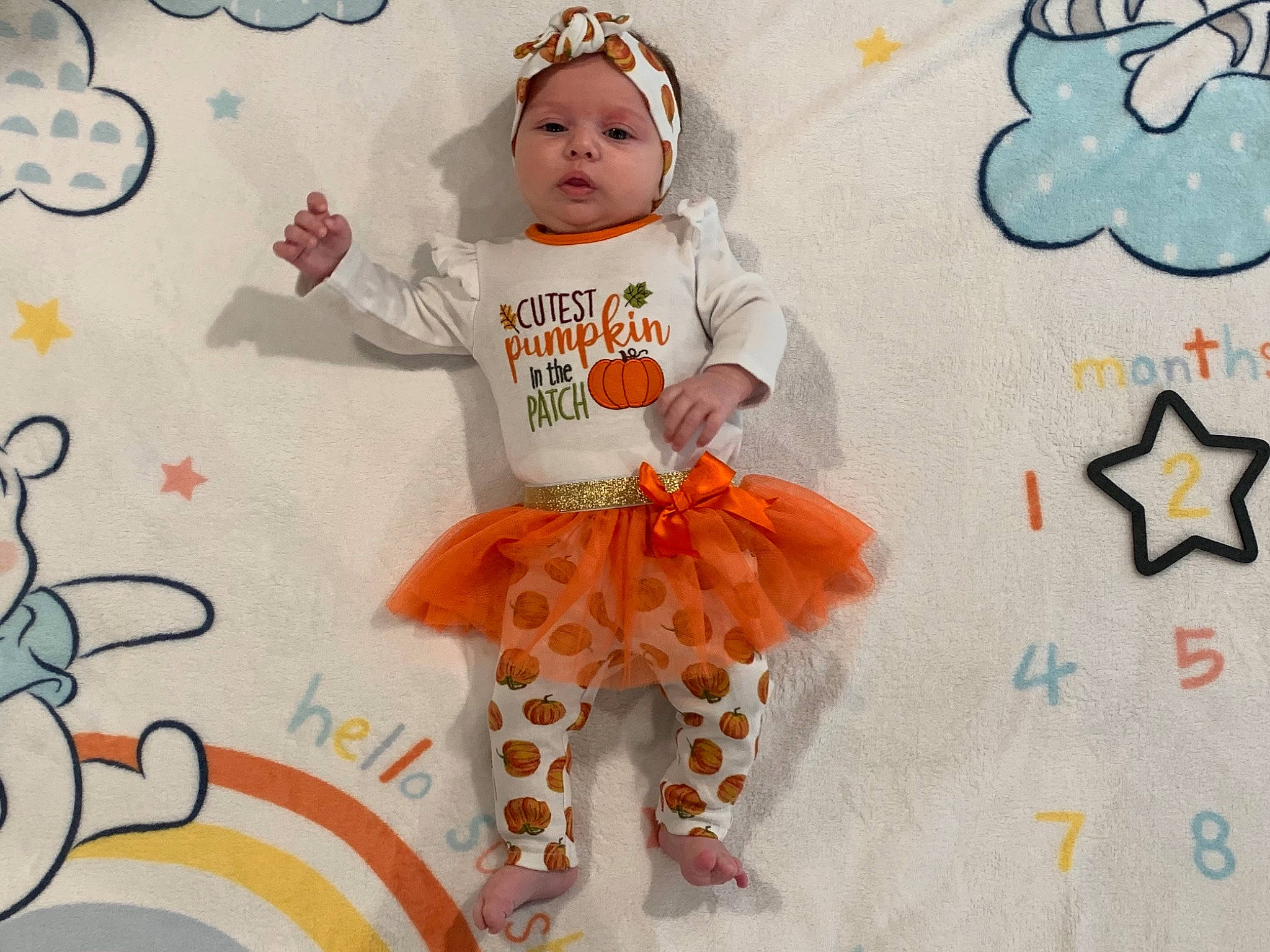 Finley joined the competition — help win amazing prizes! baby, baby_toddler_clothing, child, face, facial_expression, font, giraffidae, happy, head, headgear, headwear, outerwear, pattern, person, pink, product, sleeve, t_shirt, textile, toddler