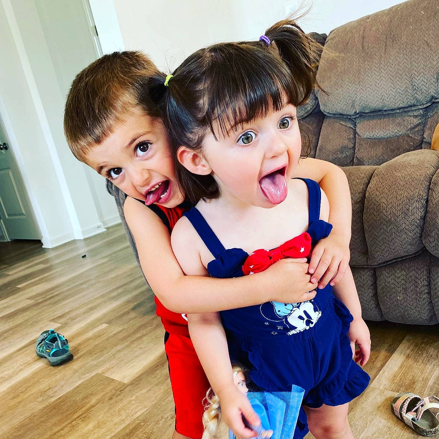 Ainsley is registered to the contest to win money with this photo: baby_toddler_clothing, child, couch, facial_expression, finger, fun, gesture, hair, hairstyle, happy, head, person, shoe, shoulder, skin, sleeve, smile, surprise, thigh, toddler